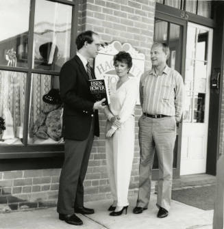 David Eisenhower and a couple stand in front of Hackett House, Sister City Oktoberfest
