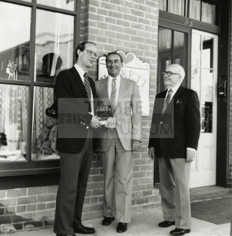 David Eisenhower and two men, standing in front of Hackett House, Sister City Oktoberfest