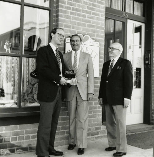 David Eisenhower and two men, standing in front of Hackett House, Sister City Oktoberfest