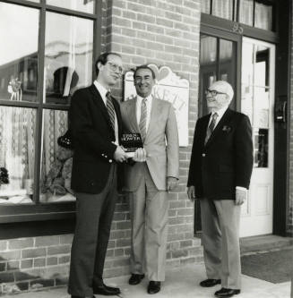 David Eisenhower and two men, standing in front of Hackett House, Sister City Oktoberfest