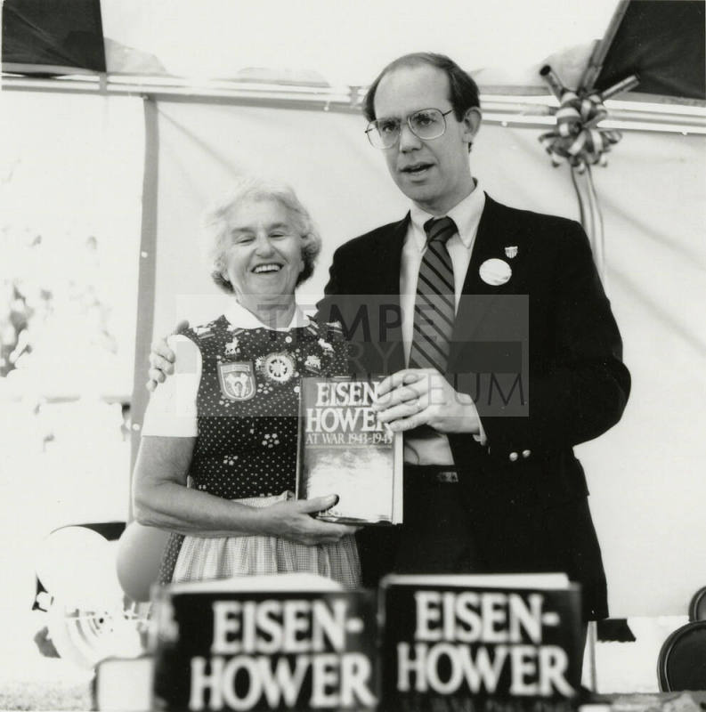 David Eisenhower and a woman at a book signing, Sister City Oktoberfest