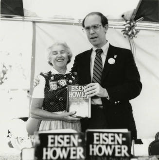 David Eisenhower and a woman at a book signing, Sister City Oktoberfest
