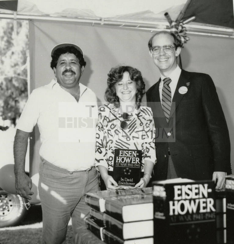 David Eisenhower and a couple at a book signing, Sister City Oktoberfest