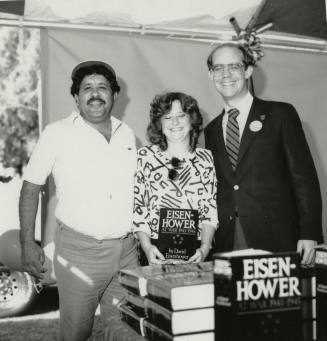 David Eisenhower and a couple at a book signing, Sister City Oktoberfest