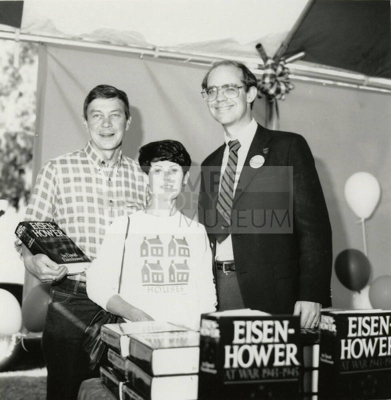 David Eisenhower and a couple at a book signing, Sister City Oktoberfest