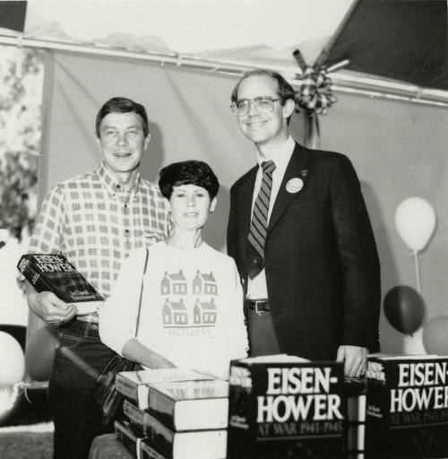 David Eisenhower and a couple at a book signing, Sister City Oktoberfest