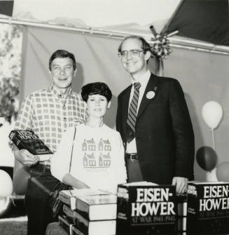 David Eisenhower and a couple at a book signing, Sister City Oktoberfest