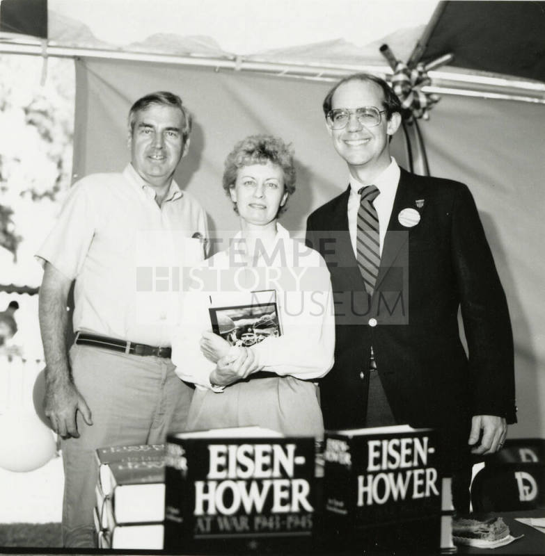 David Eisenhower and a couple at a book signing, Sister City Oktoberfest