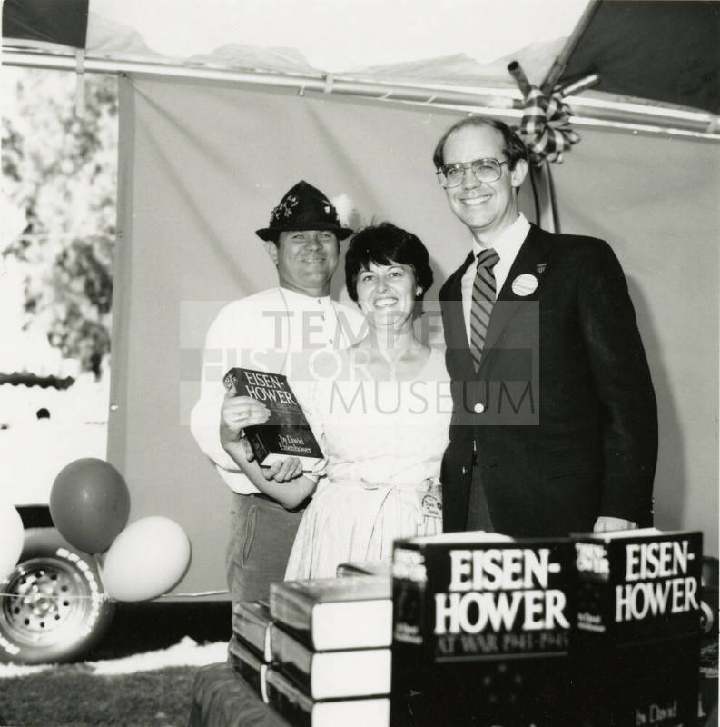 David Eisenhower and a couple at a book signing, Sister City Oktoberfest
