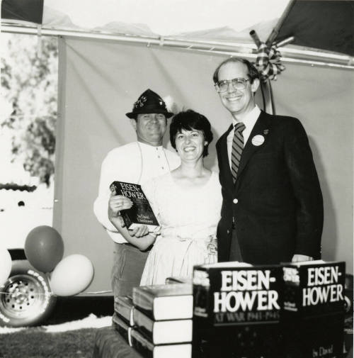 David Eisenhower and a couple at a book signing, Sister City Oktoberfest