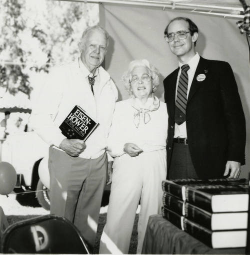 David Eisenhower and a couple at a book signing, Sister City Oktoberfest