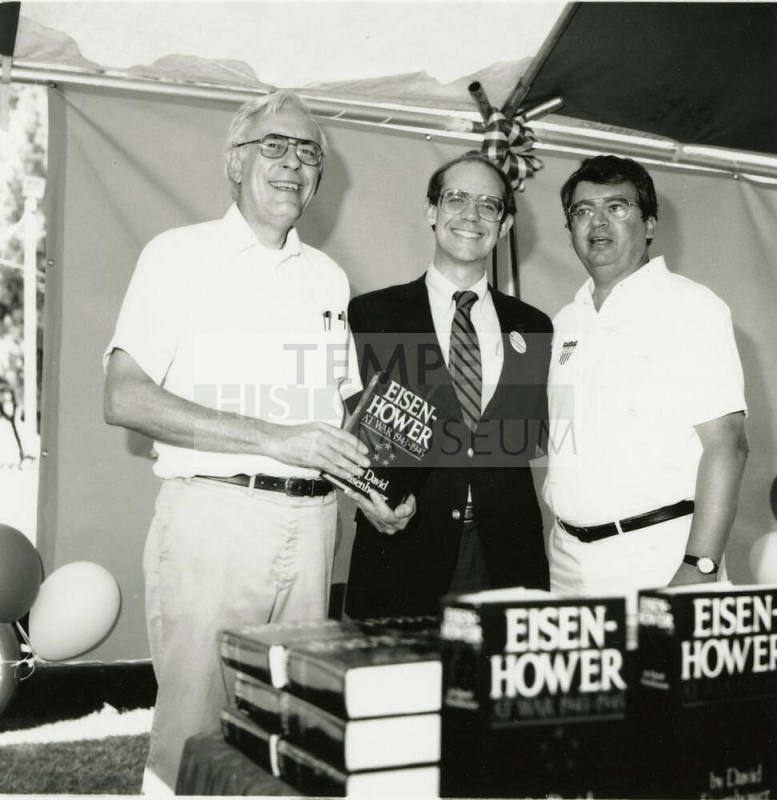 David Eisenhower and two men at a book signing, Sister City Oktoberfest