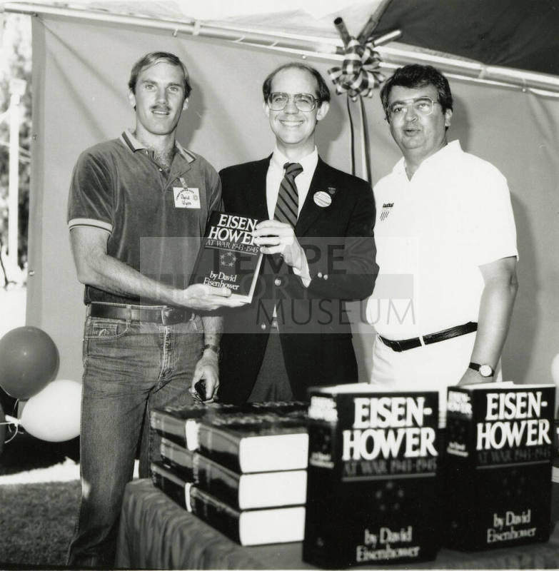 David Eisenhower and two men at a book signing, Sister City Oktoberfest