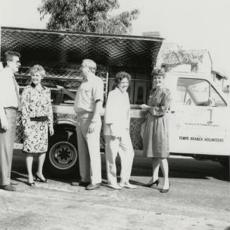 Group Stands in Front of American Red Cross Truck