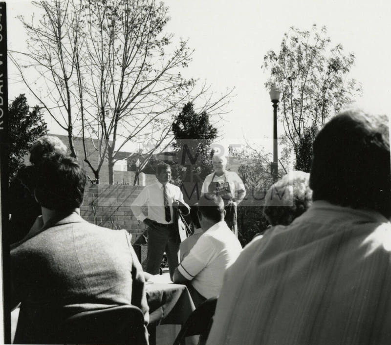 Two unidentified people in the courtyard at the Hackett House