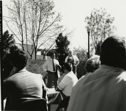 Two unidentified people in the courtyard at the Hackett House