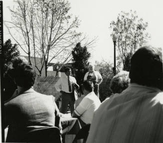 Two unidentified people in the courtyard at the Hackett House