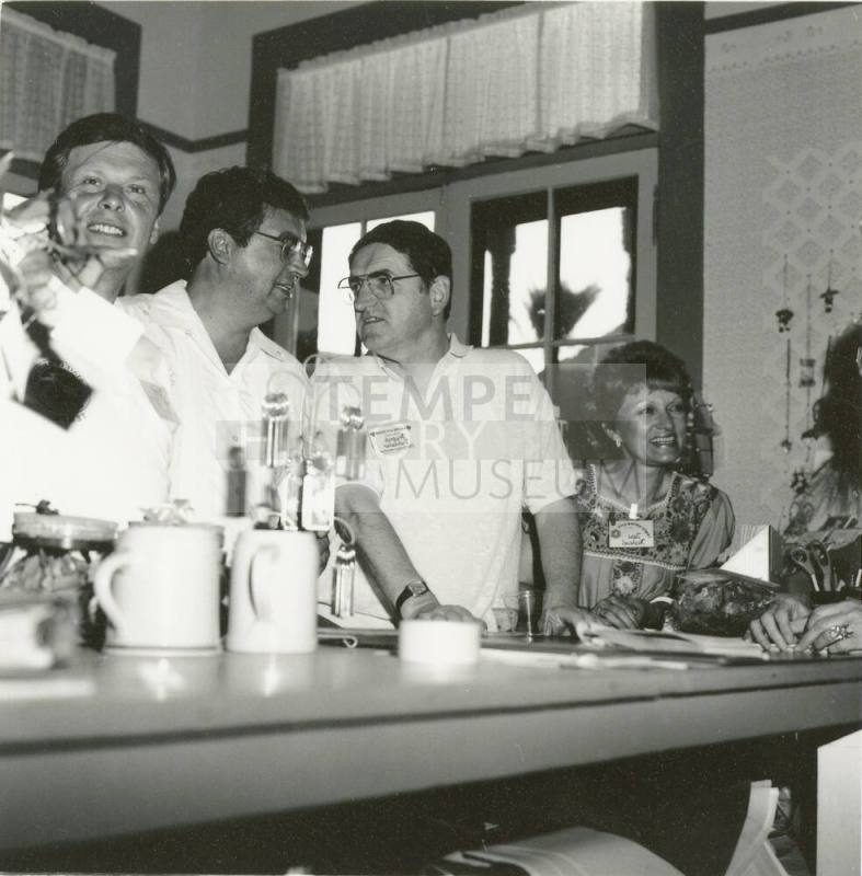 People at the counter inside the Hackett House
