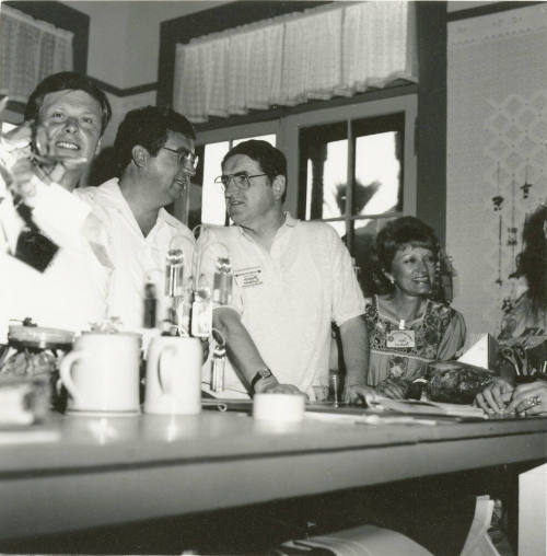 People at the counter inside the Hackett House