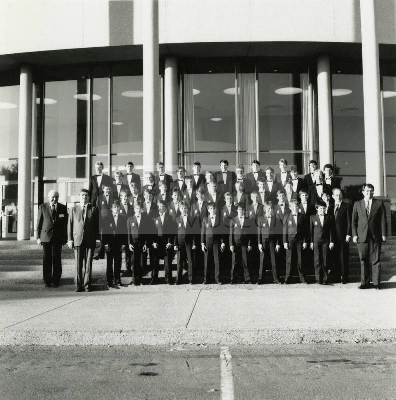 Unidentified boys' and men's choir pose for a photograph outside of Gammage Auditorium at ASU Tempe Campus