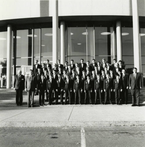 Unidentified boys' and men's choir pose for a photograph outside of Gammage Auditorium at ASU Tempe Campus