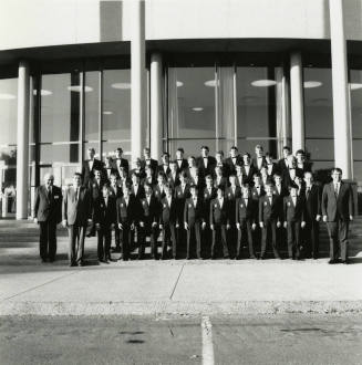 Unidentified boys' and men's choir pose for a photograph outside of Gammage Auditorium at ASU Tempe Campus