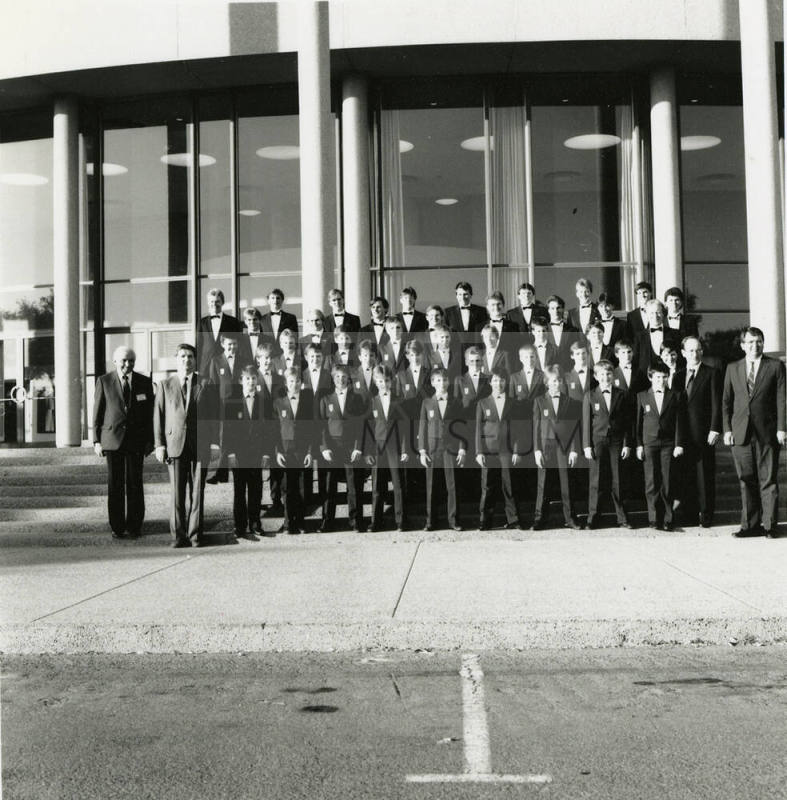 Unidentified boys' and men's choir pose for a photograph outside of Gammage Auditorium at ASU Tempe Campus