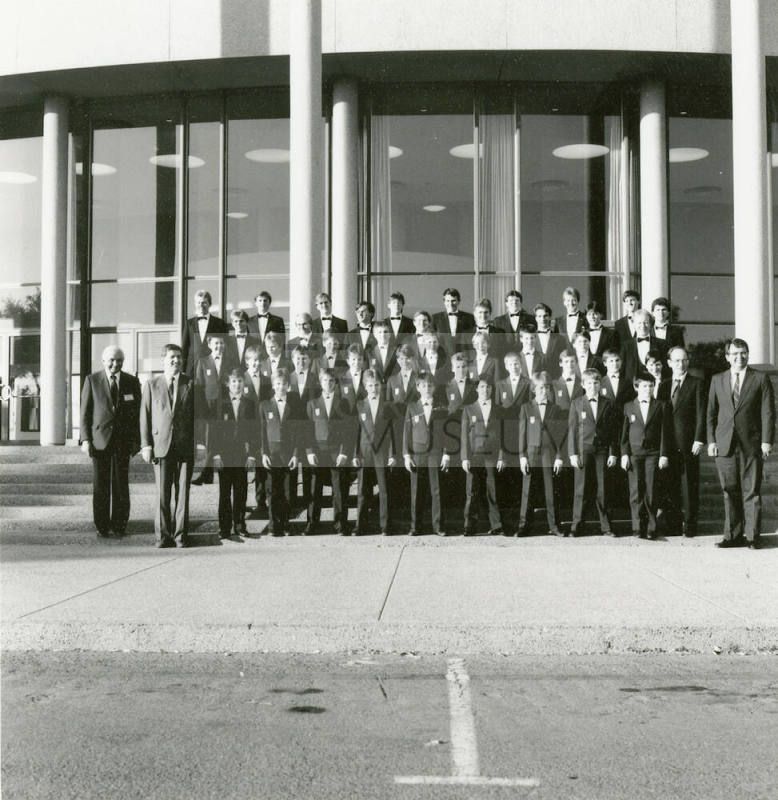 Unidentified boys' and men's choir pose for a photograph outside of Gammage Auditorium at ASU Tempe Campus