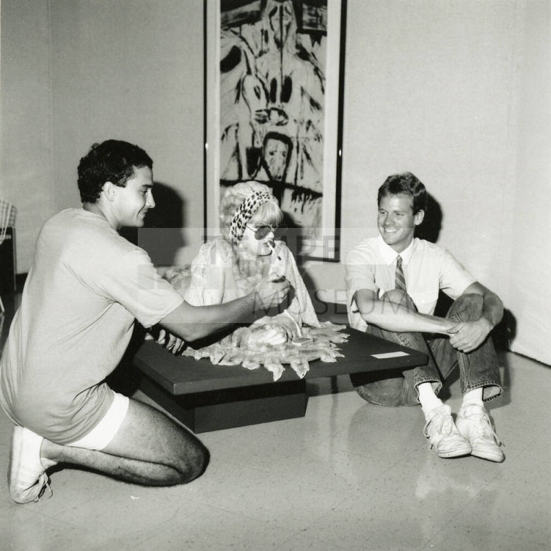 Two men and a statue.