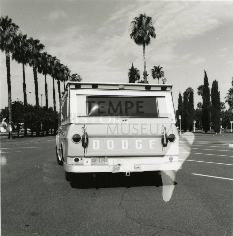 Dodge truck parked in an empty parking lot, photographed from the back