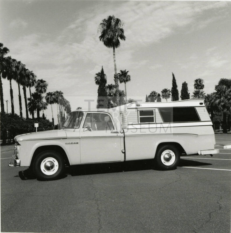 Dodge truck parked in an empty parking lot, photographed from the side