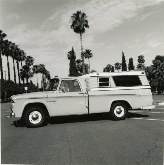 Dodge truck parked in an empty parking lot, photographed from the side