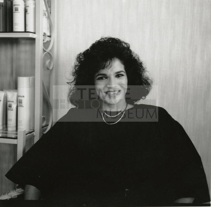 Unidentified woman posing for the camera at a salon