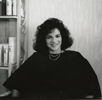 Unidentified woman posing for the camera at a salon
