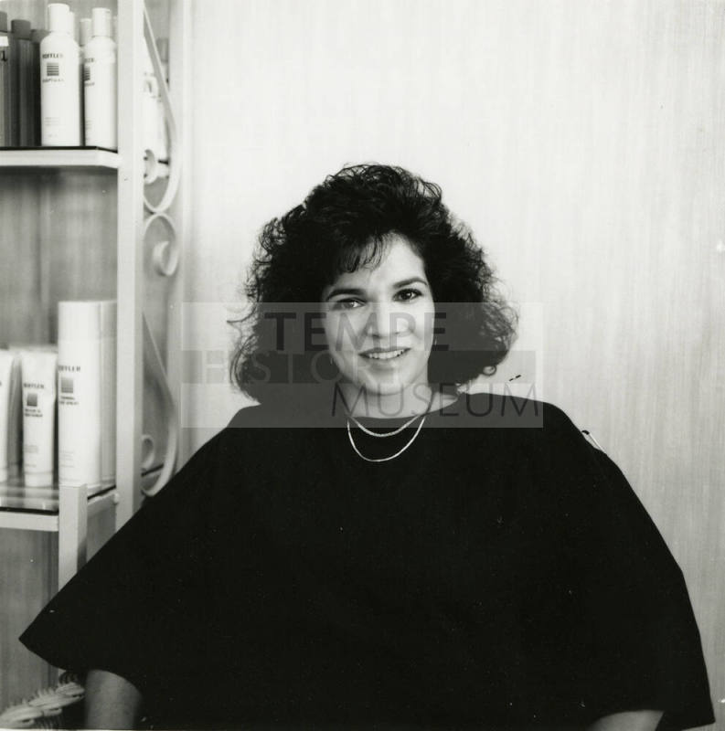 Unidentified woman posing for the camera at a salon