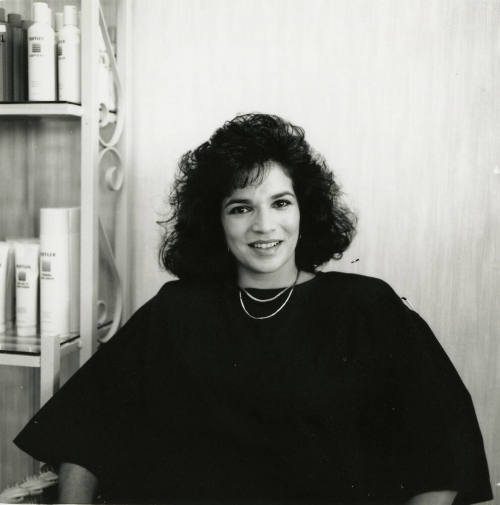 Unidentified woman posing for the camera at a salon