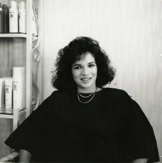 Unidentified woman posing for the camera at a salon