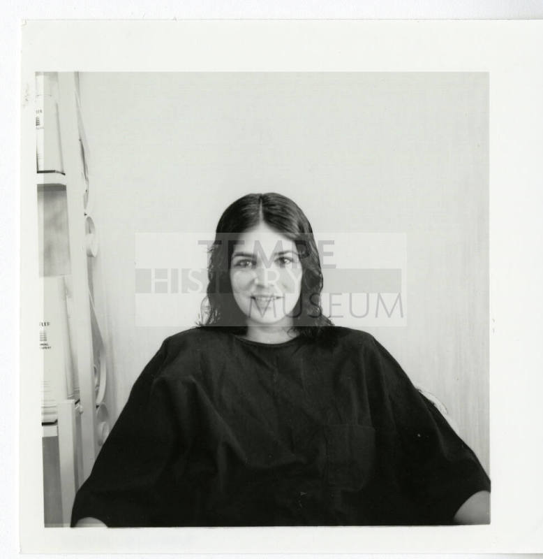 Unidentified woman posing for the camera at a salon.