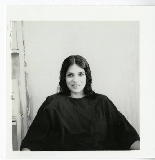 Unidentified woman posing for the camera at a salon.