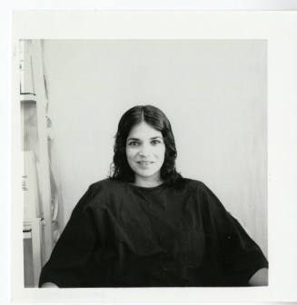 Unidentified woman posing for the camera at a salon.