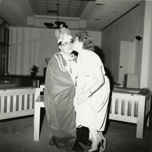 Giving the king a kiss.