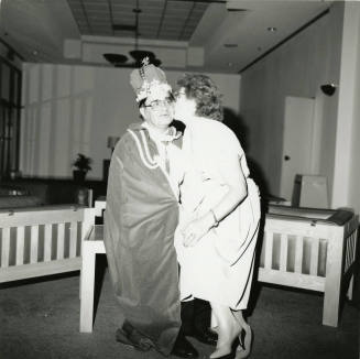 Giving the king a kiss.