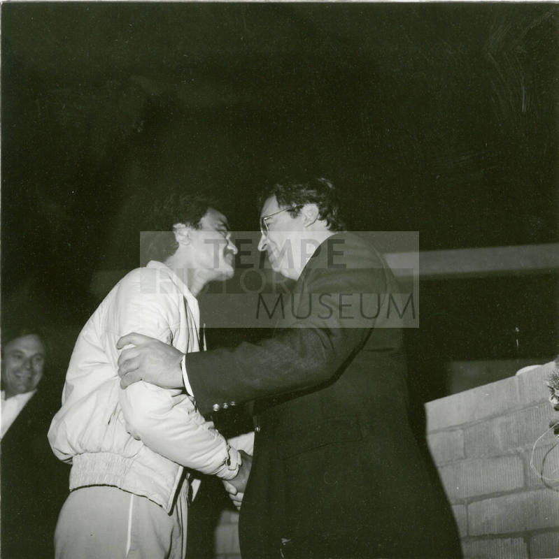 Rangi Luke and Richard Neuheisel rub noses - a Maori greeting