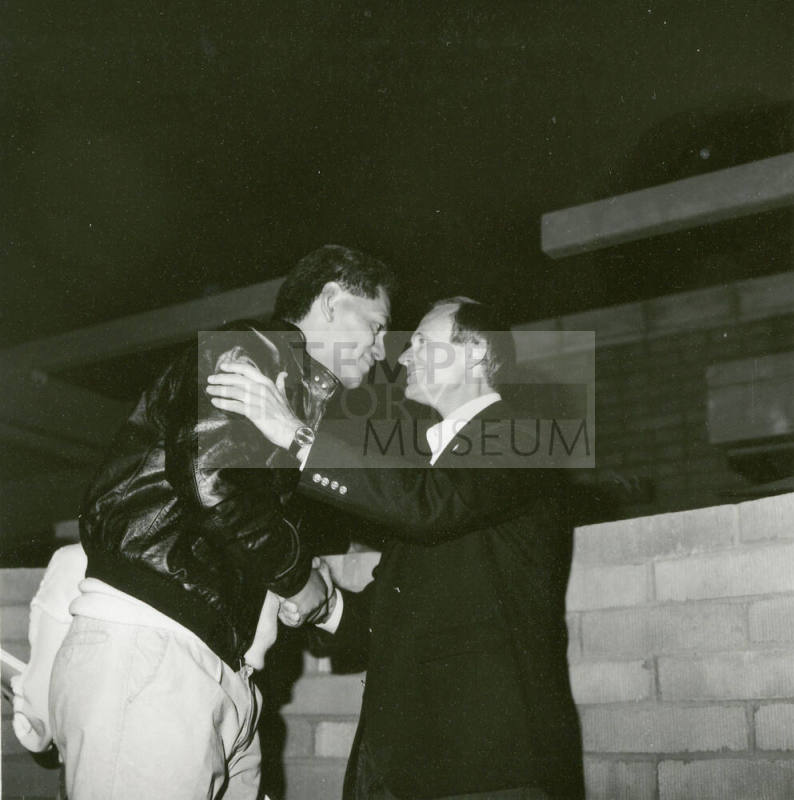 Two people shaking hands.