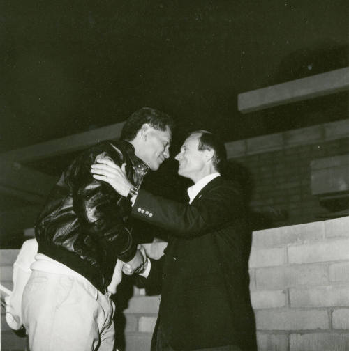 Two people shaking hands.
