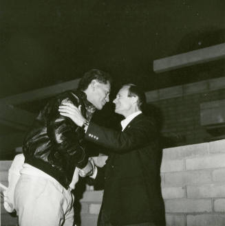 Two people shaking hands.