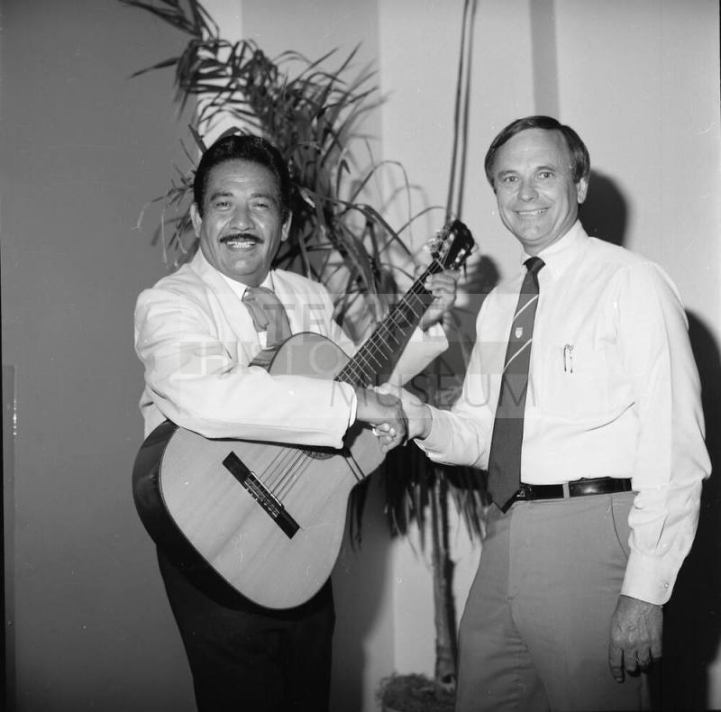 Harry Mitchell Shakes Hands with Unidentified Musician