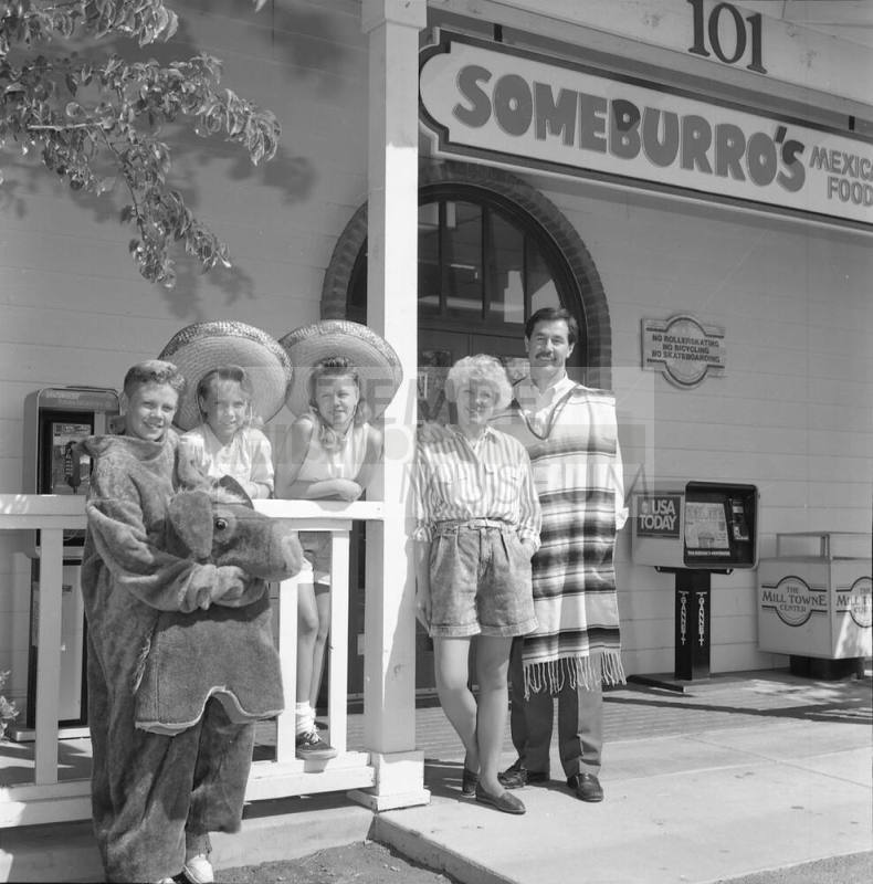 The Vasquez family standing outside of Someburro's on Mill and Baseline