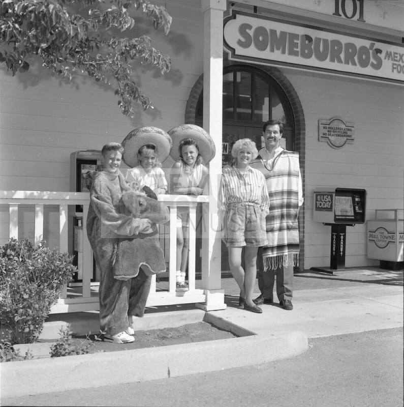 The Vasquez family standing outside of Someburro's on Mill and Baseline