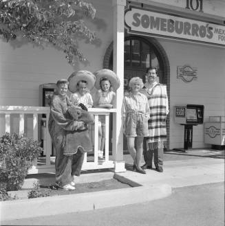 The Vasquez family standing outside of Someburro's on Mill and Baseline